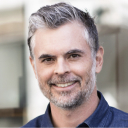 Adam against a light background