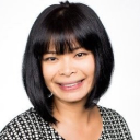 Rebecca against a light background